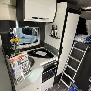 Britz Odyssey 4 Berth NZ Rear Transverse East West Bed Layout 03 East West Bed And Kitchen